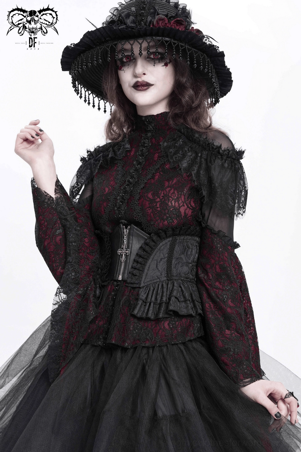 Black victorian corset belt with ruffled lace trim and metal hardware, lifestyle gothic fashion