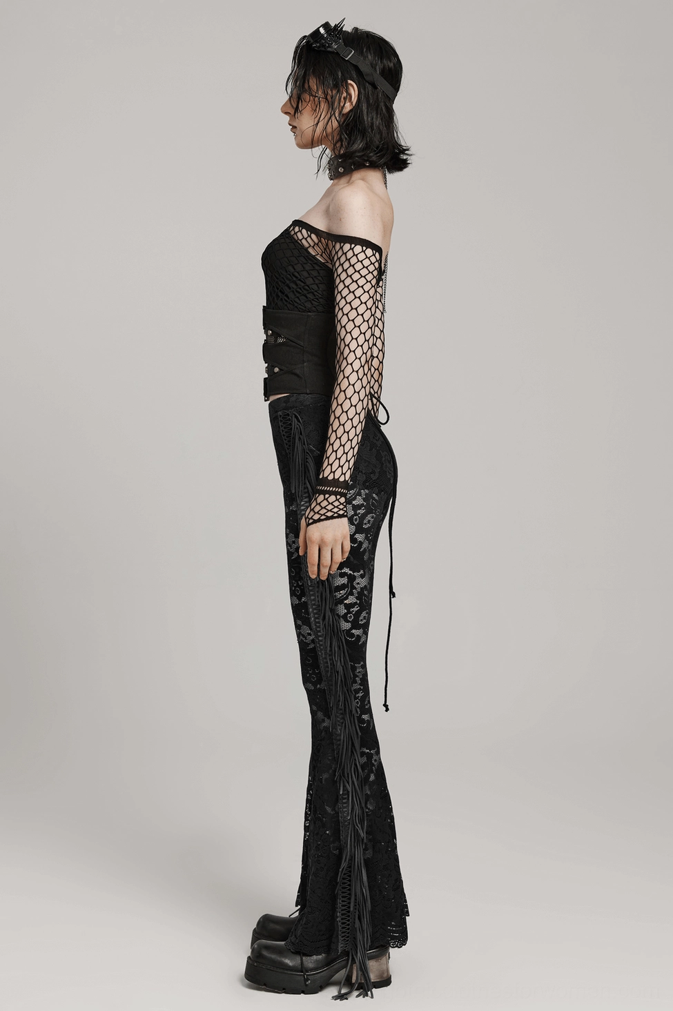Black gothic corset belt styling detail showcasing how mesh panels coordinate with metal hardware for cohesive edgy aesthetic