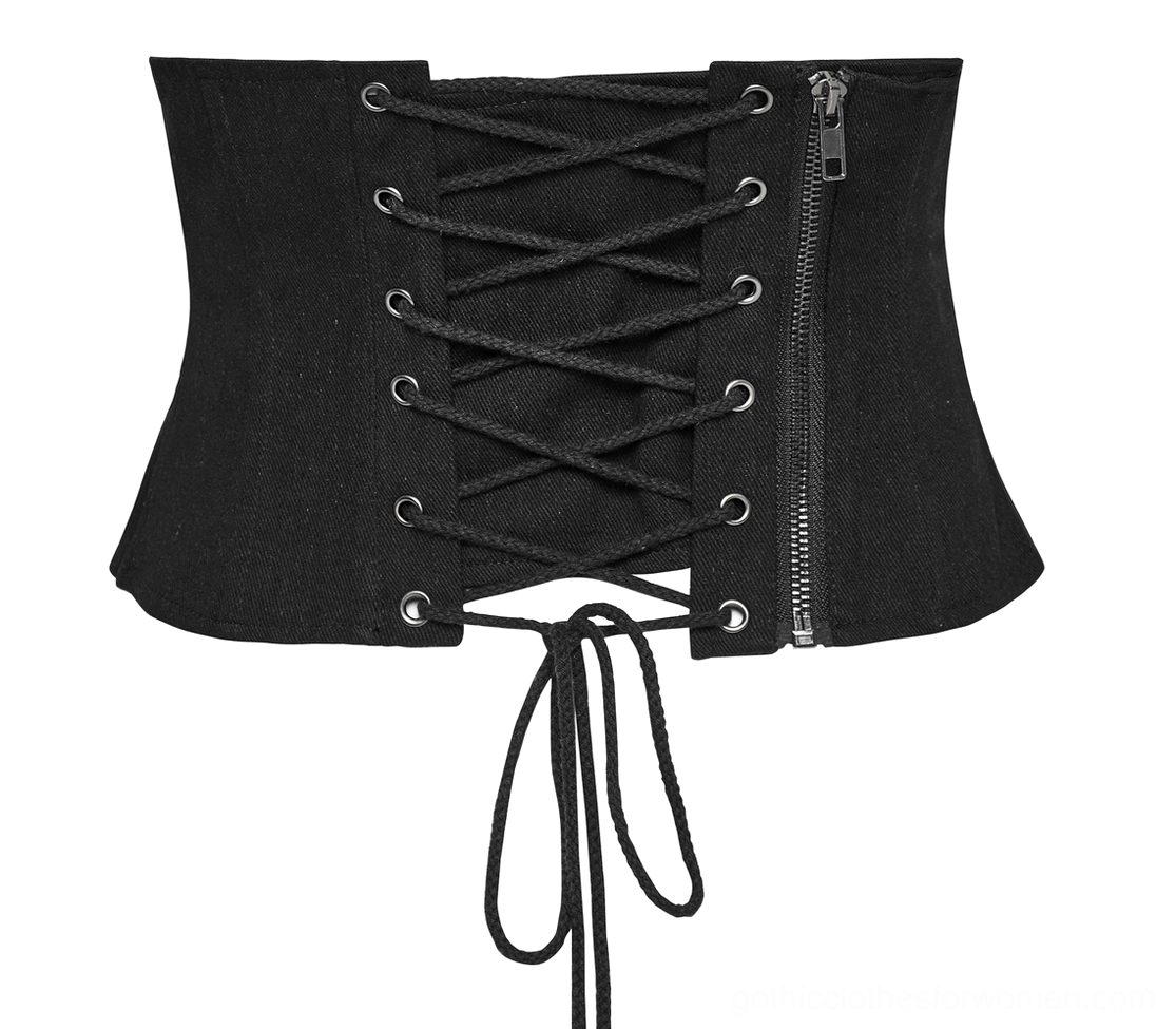 Side flat lay view of black gothic corset belt showing functional side zipper, crisscross lacing system, and metal eyelet placement
