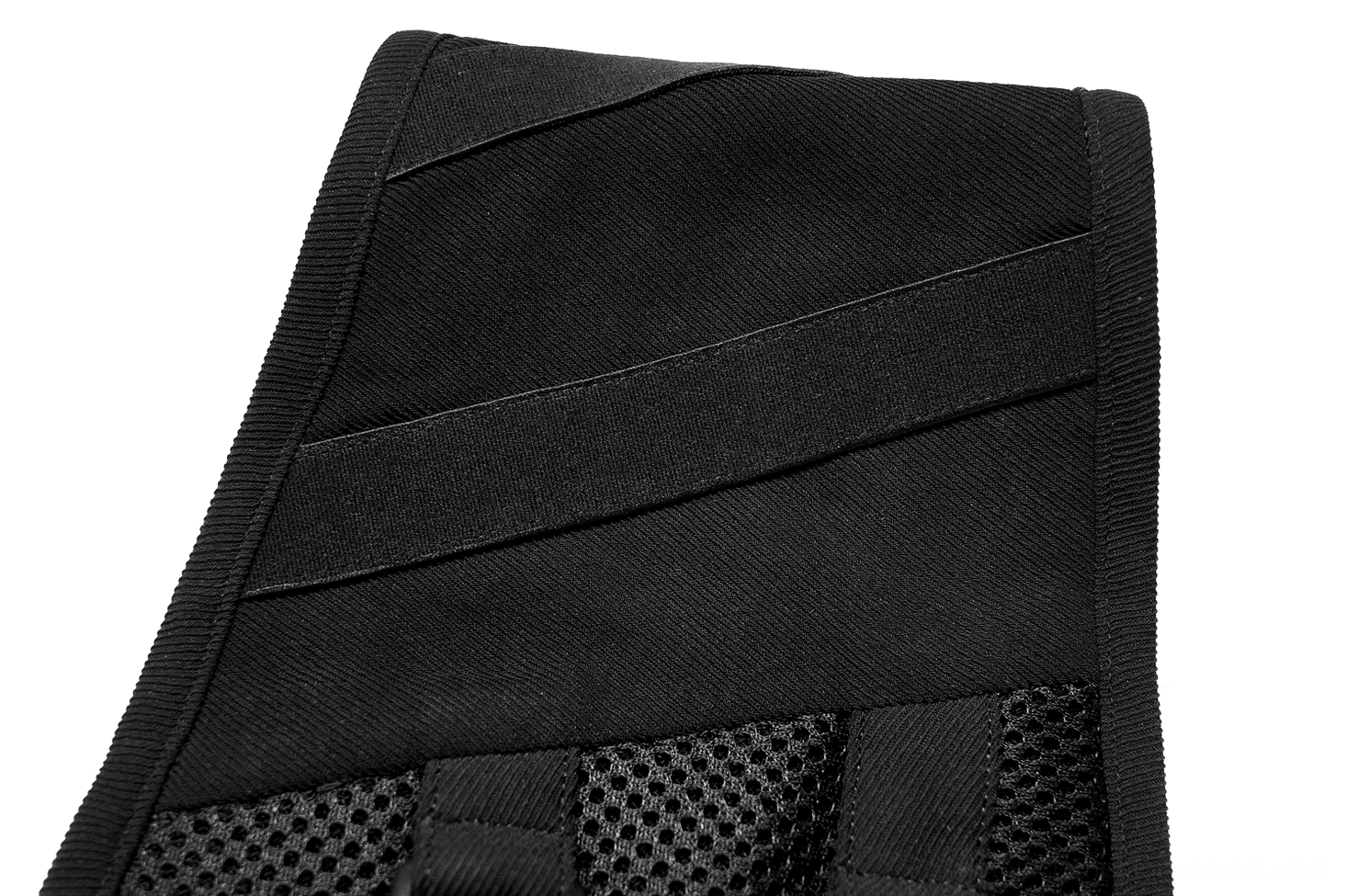 Close-up side view of black corset belt showing woven twill texture, stitched panels, and mesh insert construction details