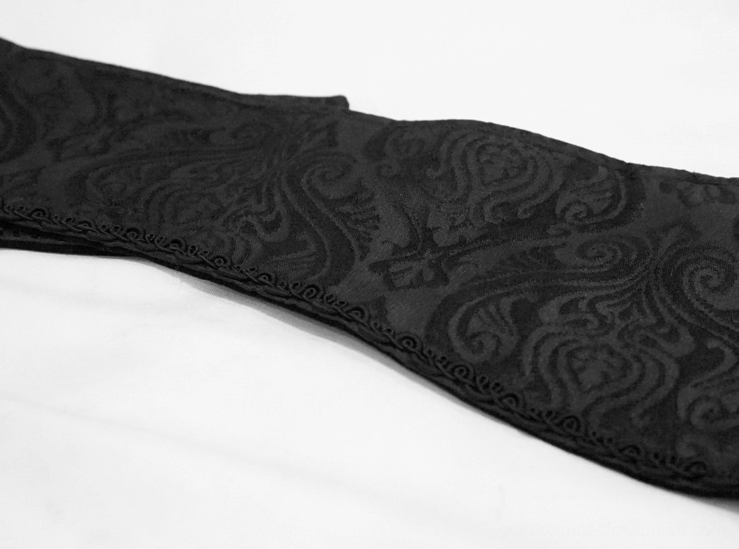 Black gothic corset belt merchandise photography showing versatile styling with alternative fashion outfits