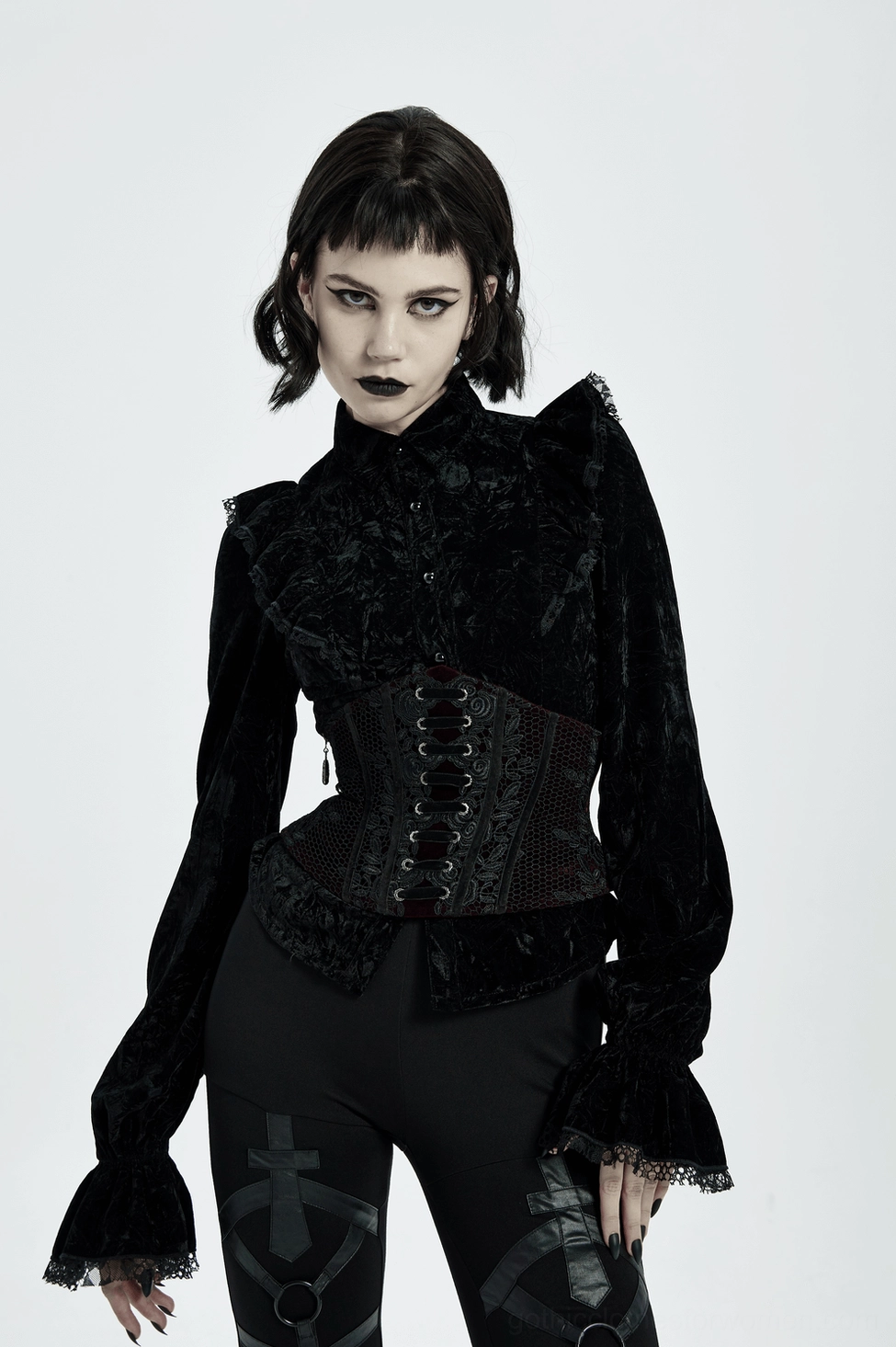 Waist cinching corset belt on model wearing dark gothic outfit showing silhouette effect