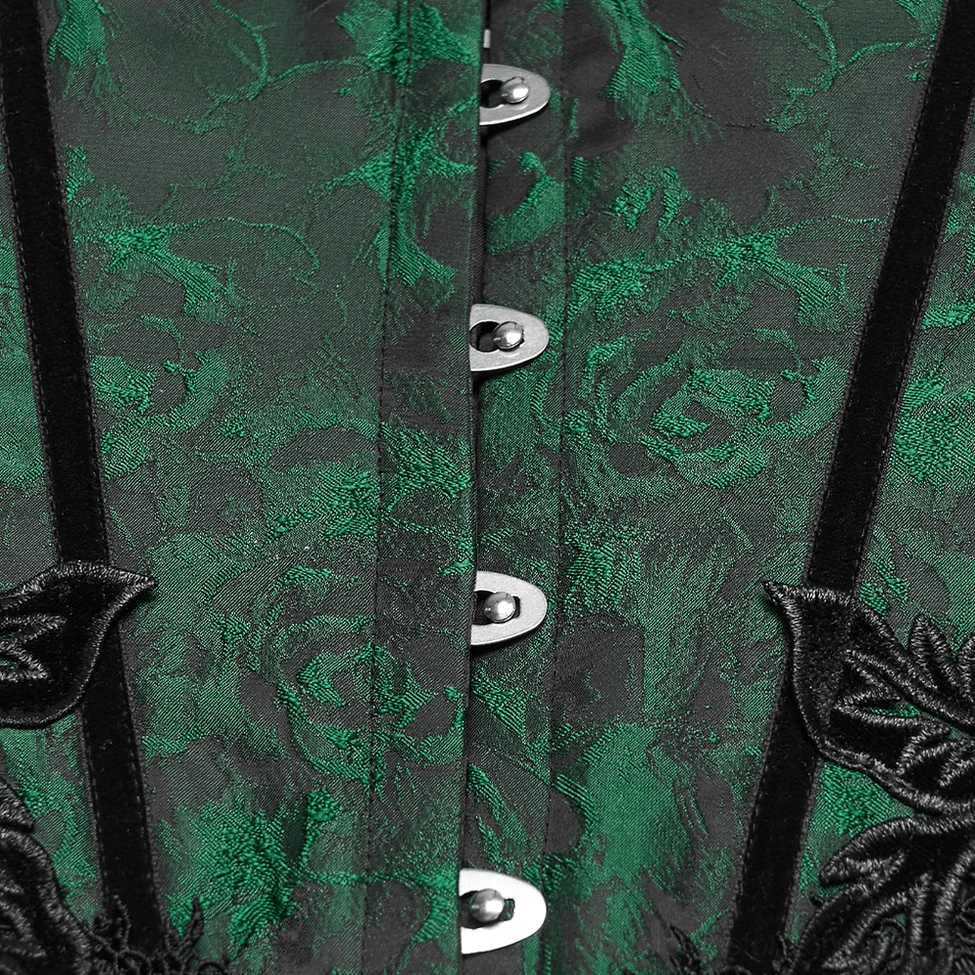 Close-up detail of emerald jacquard gothic corset front closure showing silver metal buttons and black velvet trim against green floral pattern