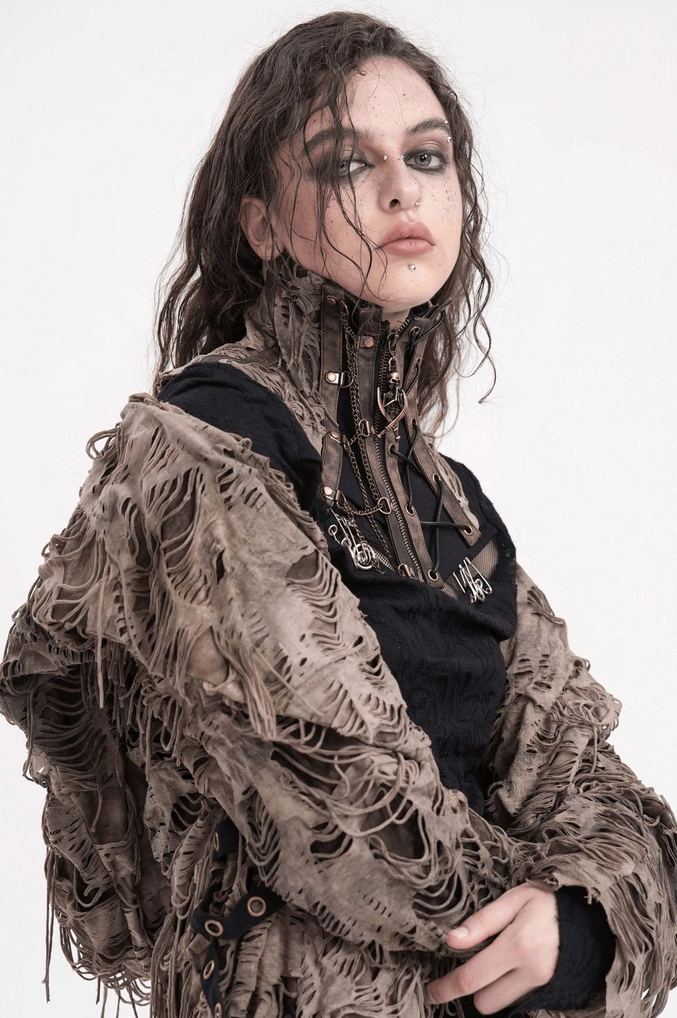 Gothic corset choker styling on model showing distressed aesthetic and chain details against alternative fashion