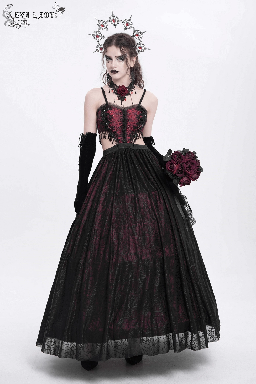 Gothic floral corset maxi dress showing cut-out waist design and floor-length tulle skirt with roses