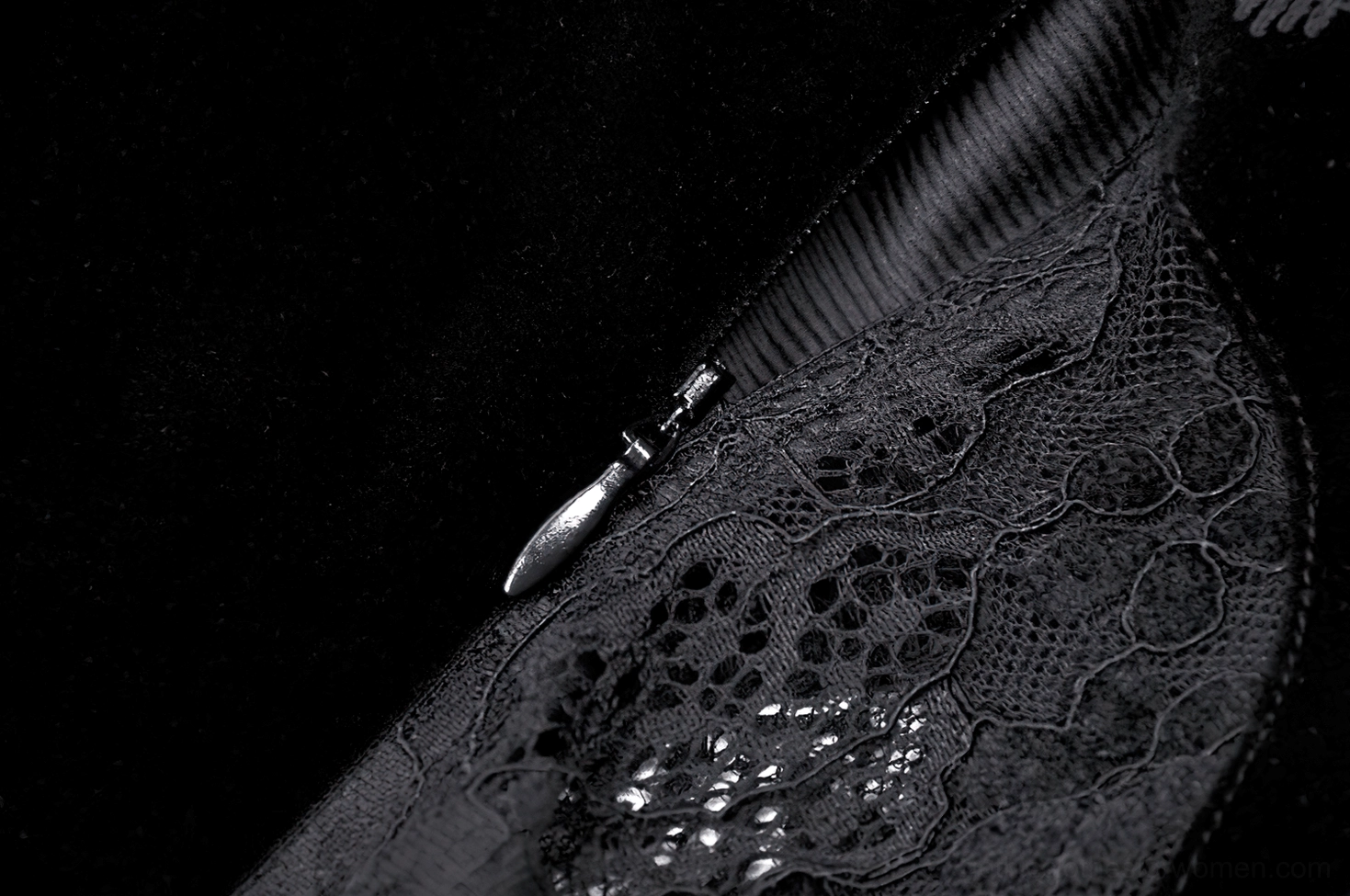 Detailed view of gothic corset dress showing lace layering and structural bodice design