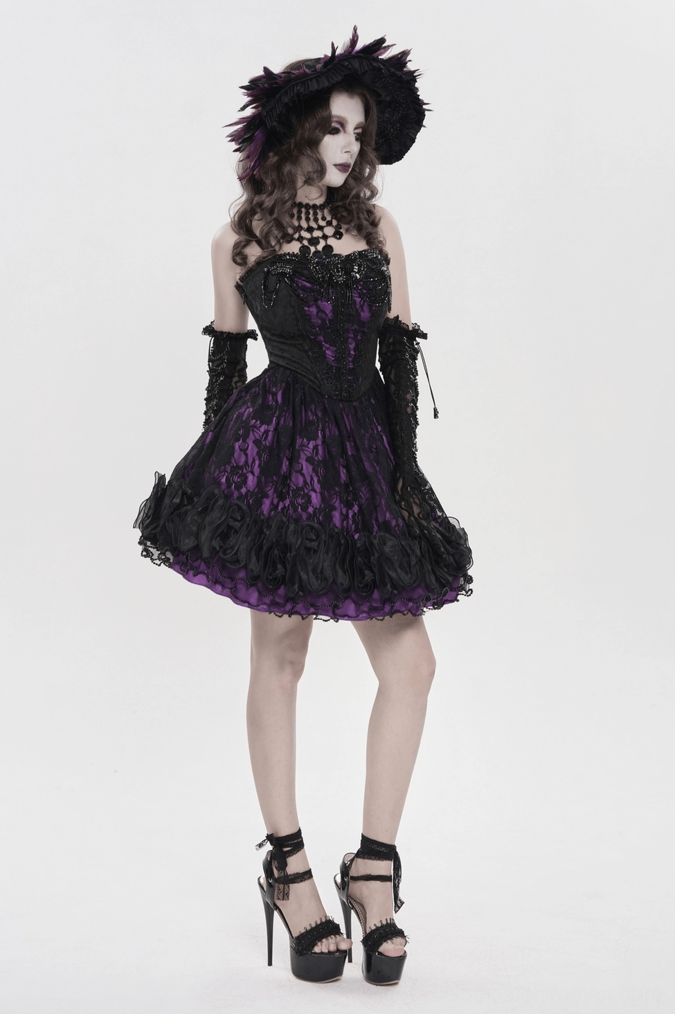 Rear angle view of gothic corset mini dress highlighting lace-up back and ruffled hem layering