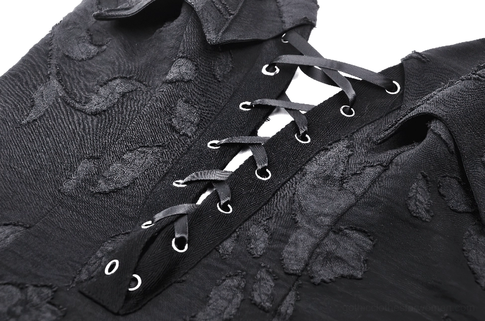 Side close-up detail of gothic dress lace-up front and leather laces with floral jacquard weave texture