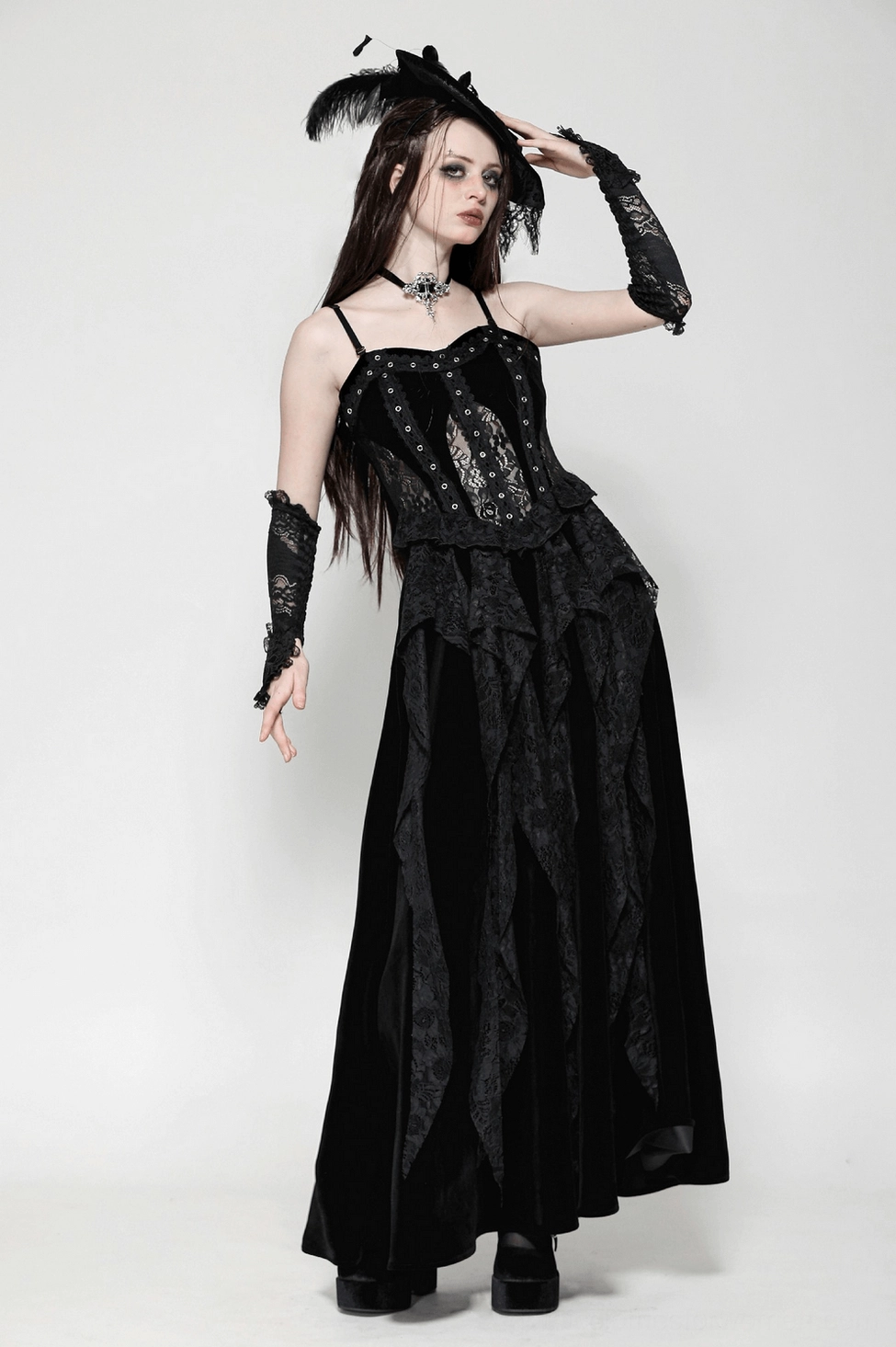 Model wearing black gothic corset maxi dress with alternative styling and accessories