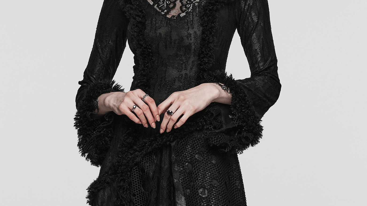 Alternative angle of gothic corset lace dress displaying waist shaping, layered skirt construction and overall silhouette grace