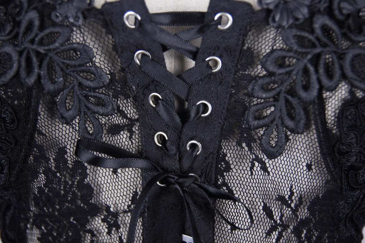 Black gothic sheer corset fabric texture detail, knit weave and lace appliqué combination close-up