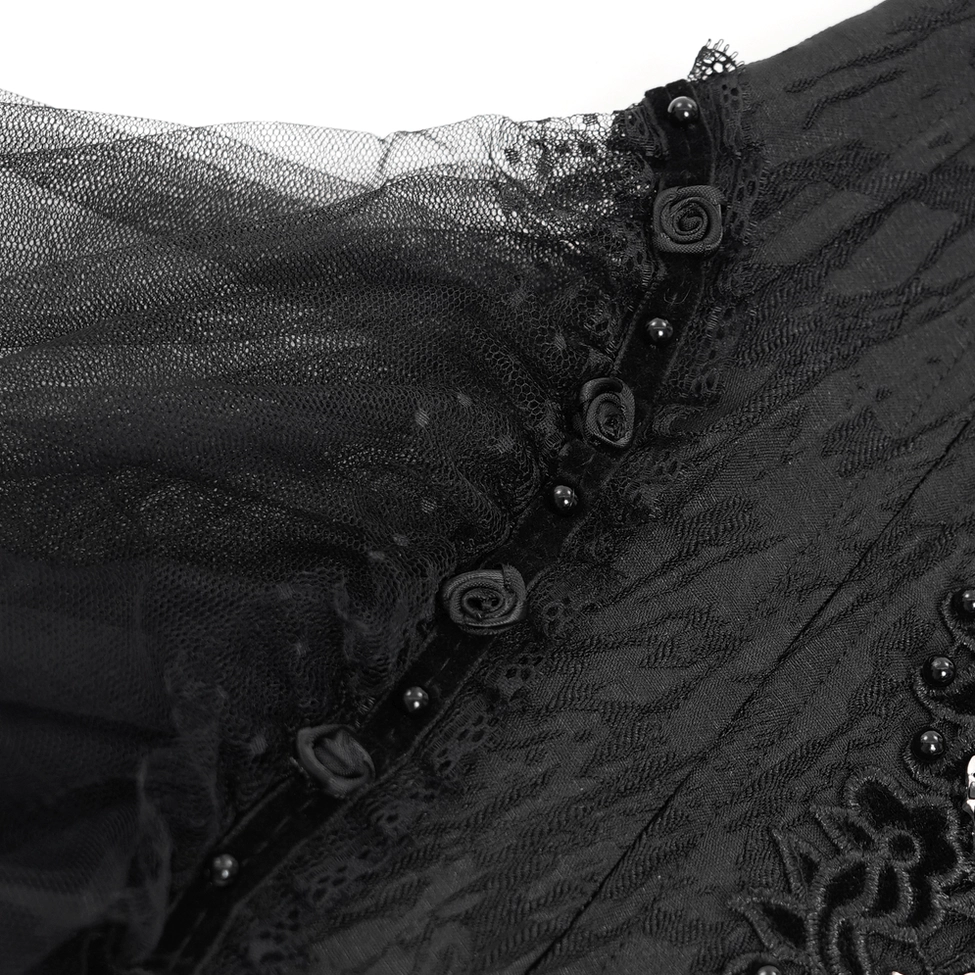 Black gothic corset with lace and tulle showing front panel construction, metal ornaments, and layered fabric design