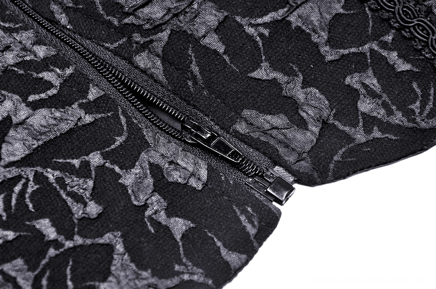 Black lace-up gothic corset detail view of front panel with beaded floral design and lace-up closure system