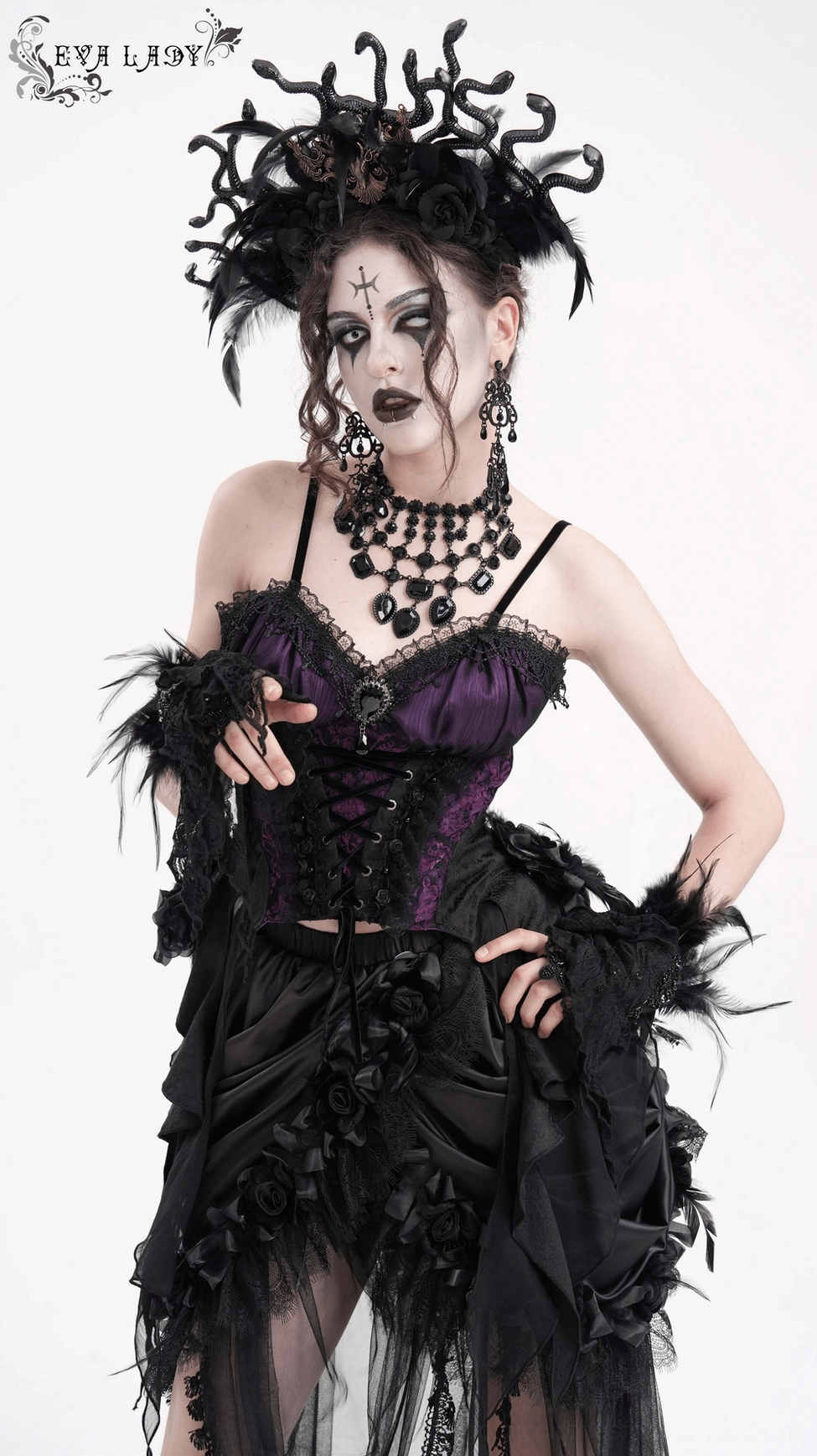 Dark gothic corset top showing intricate black floral and lace detailing on purple base fabric