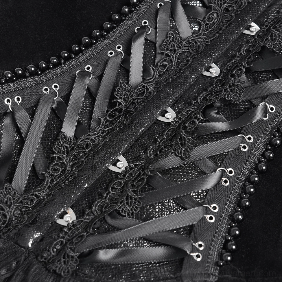 Detailed view of black gothic corset showing lace applique and beaded trim work