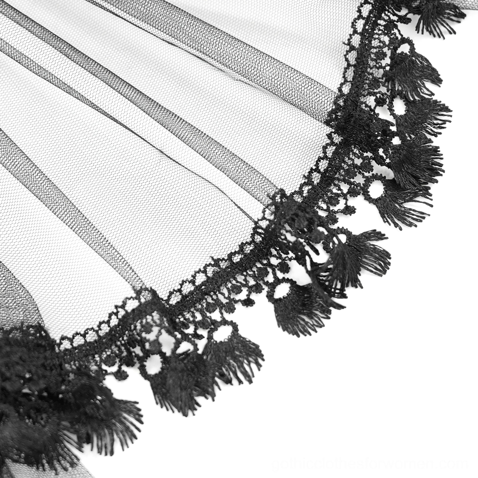 Close-up of gothic corset lace trim and tulle overlay showing delicate layered construction and texture details