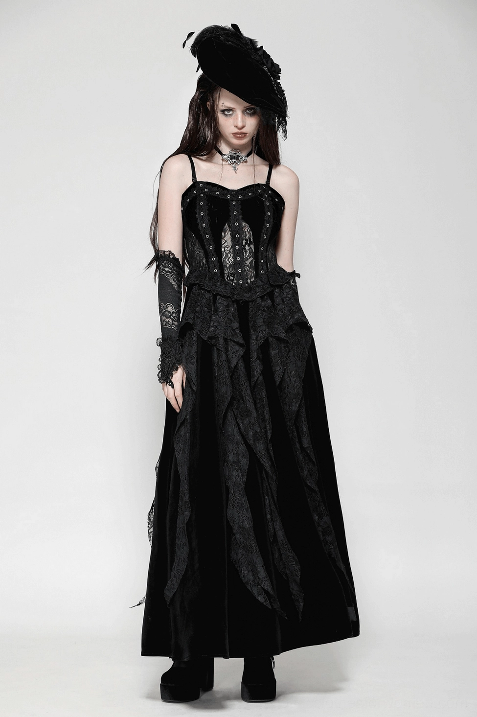 Full-body side view of gothic black corset maxi dress with cascading velvet skirt