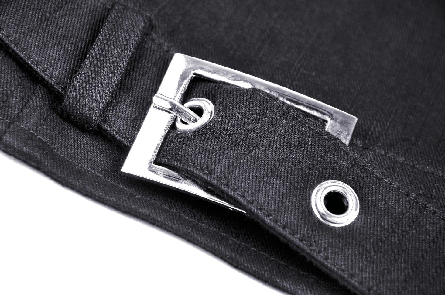 Close-up of metal waist buckle hardware on gothic crop corset