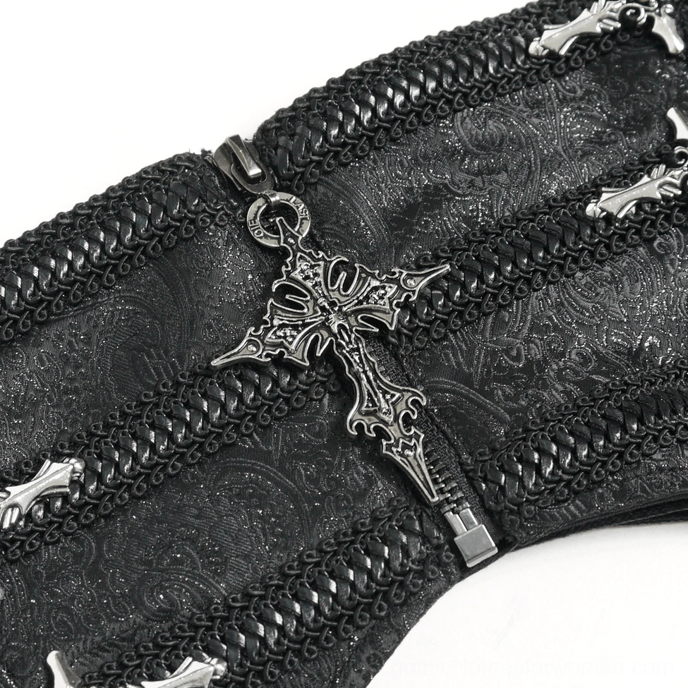 Close-up detail of black gothic corset belt metal cross ornaments and silver tone hardware finishing