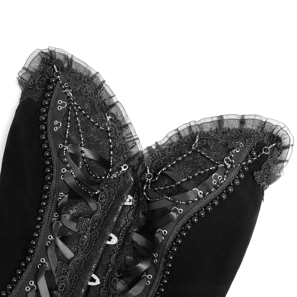 Close-up of gothic corset neckline featuring tulle ruffles, beaded trim and satin construction