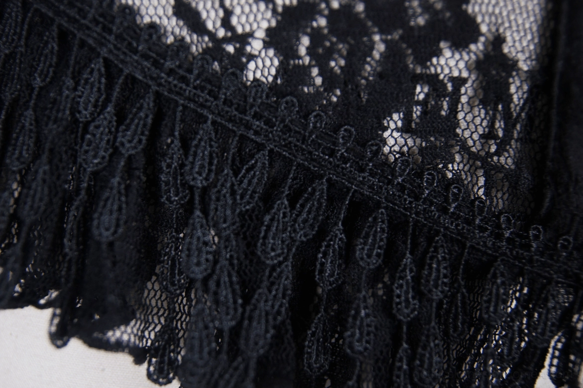 Black gothic lace corset seam and construction detail, showing polyamide fabric quality and lace placement
