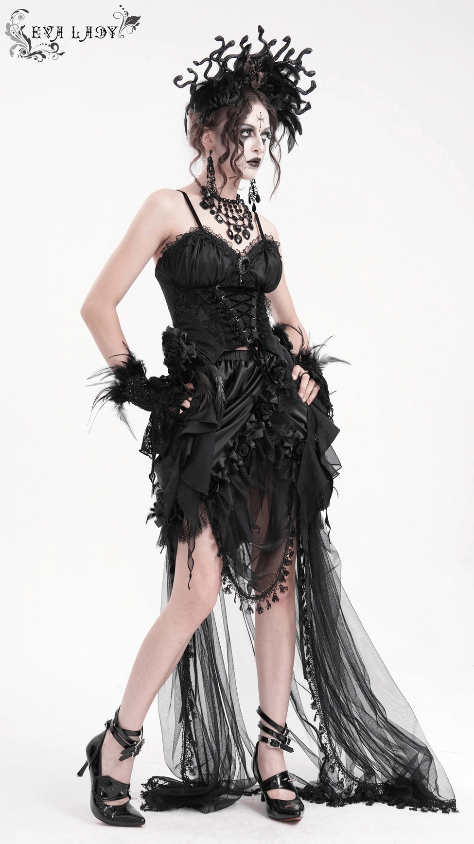 Gothic corset displaying sheer fabric details and feather embellishments with side profile view