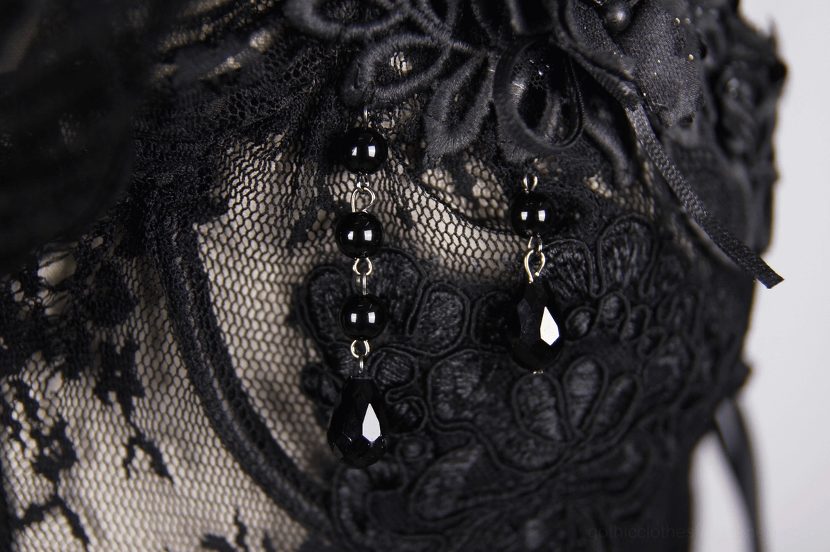 Black sheer gothic corset waist area detail, layered lace and corset structure close-up