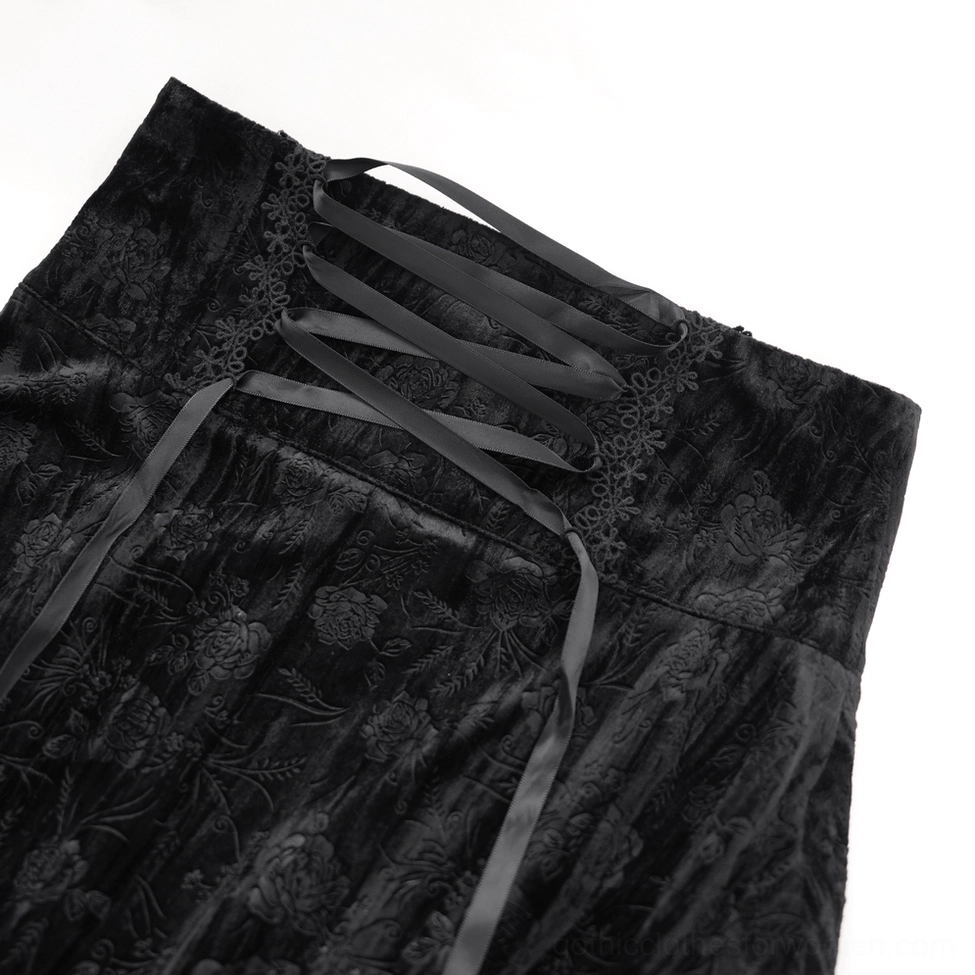 Black gothic skirt corset waist close-up showing satin ribbon lace-up closure and embroidered lace trim detail