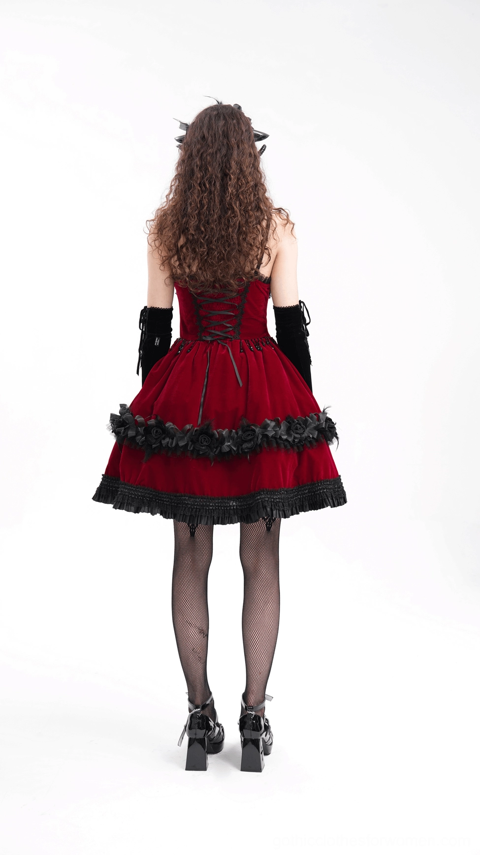 Gothic costume headpiece featuring sculptural spiral horns, ruffled trim and adjustable ribbon tie system