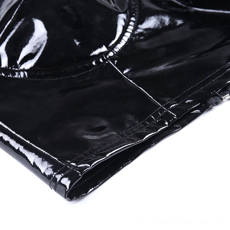 Cropped hemline detail of black patent leather hollow out cami showing straight stitched seam