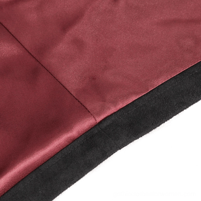 Close-up of gothic crop top shoulder embroidery featuring dark metallic beads and intricate floral applique