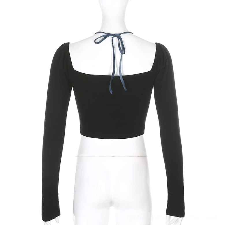 Back view of gothic crop top displaying self-tie halter strap and open square back neckline cutout detail