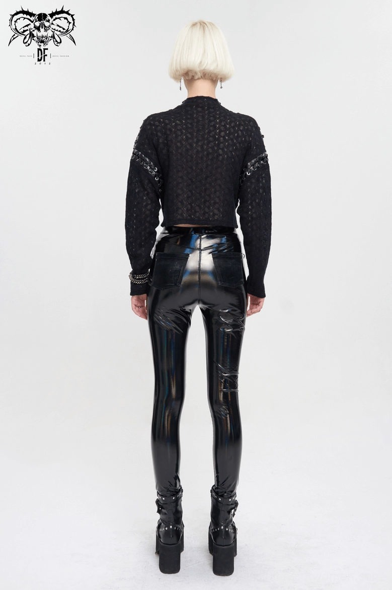Full rear view of black gothic quilted cropped top on model wearing platform boots and shiny alternative pants