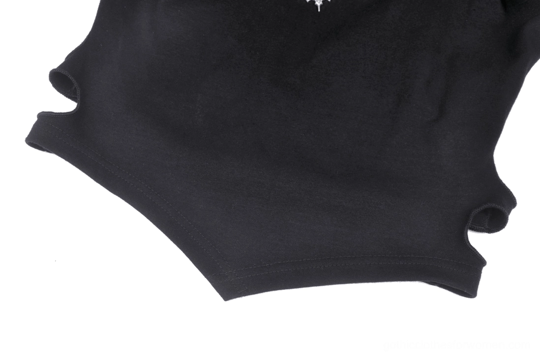 Metal bat emblem and soft stretch fabric detail of gothic lace-up crop top with silver-tone logo