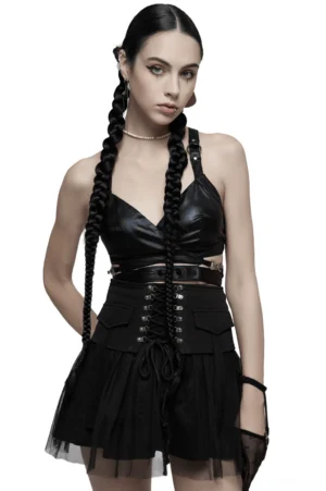 Black gothic crop top with criss-cross back straps and metal hardware, front view on model