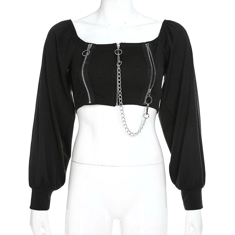 Gothic crop top with decorative zipper and chain layout on dress form
