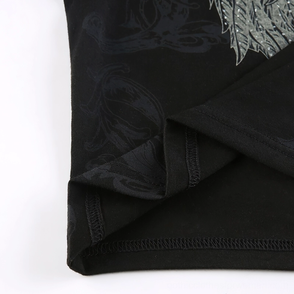 Fabric close-up of black gothic crop top - stretch knit material showing seam stitching and subtle damask texture quality
