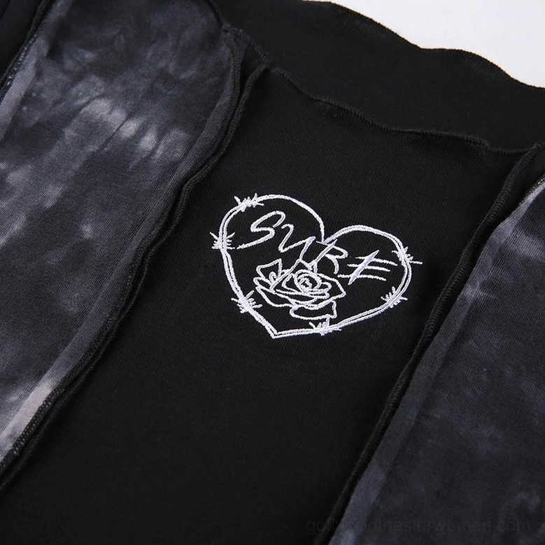 Close-up of SURE heart rose embroidery on soft stretch knit gothic crop top
