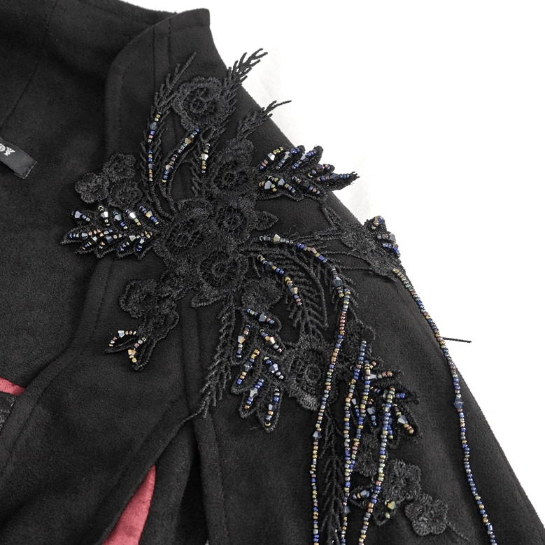 Close-up photography of gothic crop top metallic beaded floral pattern on shoulder