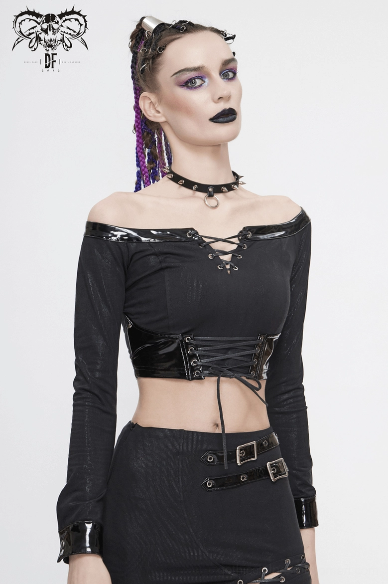 Gothic crop top showcasing off-shoulder neckline and fitted sleeves on model in studio setting