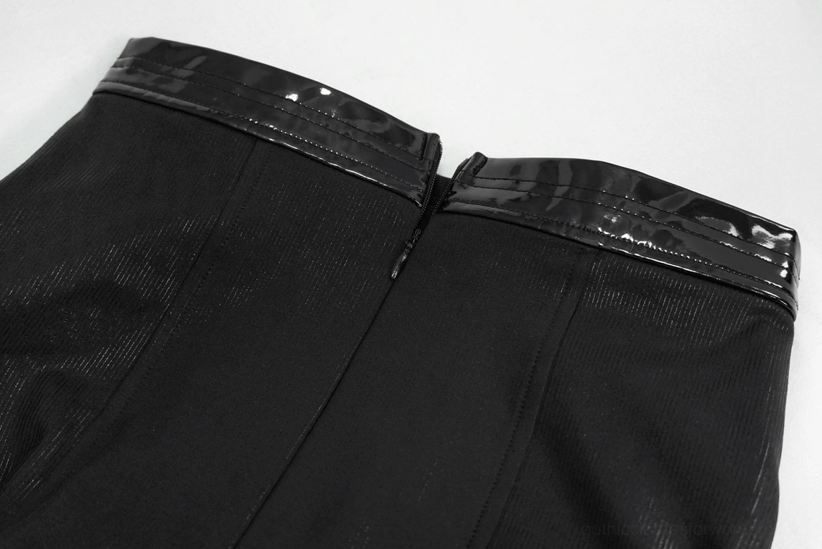 Close-up detail of gothic crop top showing patent leather trim edging and fabric weave quality