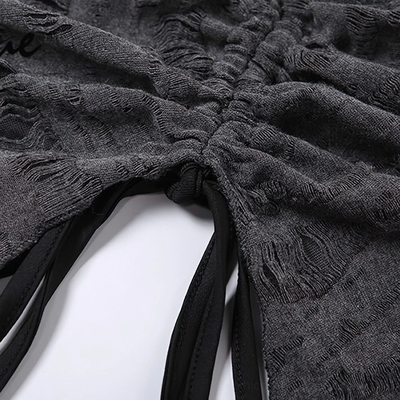 Side close-up of ruched front detail with drawstring fastening on distressed gray halter crop top - gothic edgy crop top construction