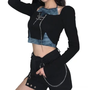 Gothic long sleeve crop top with halter detail and cutout shoulder, side-front perspective displaying chain accents and silhouette