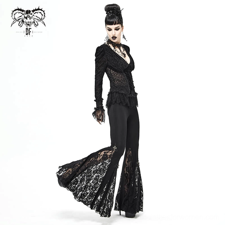 Front three-quarter view of black gothic cross lace bell-bottomed leggings worn by model in alternative fashion context