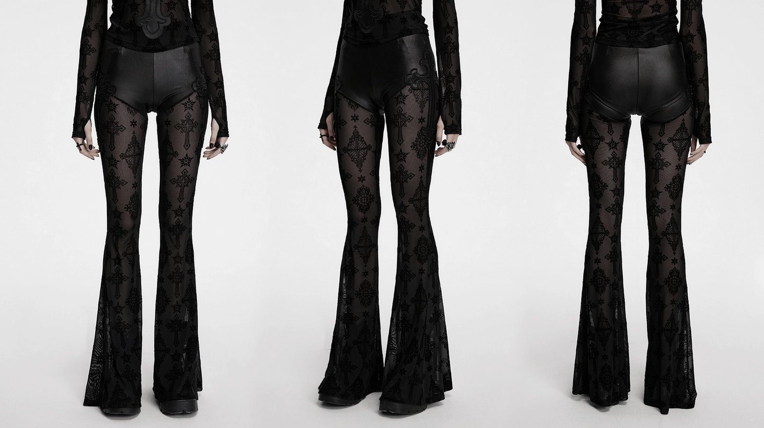 Full-body view of gothic cross mesh flare pants worn by model - black alternative fashion statement piece