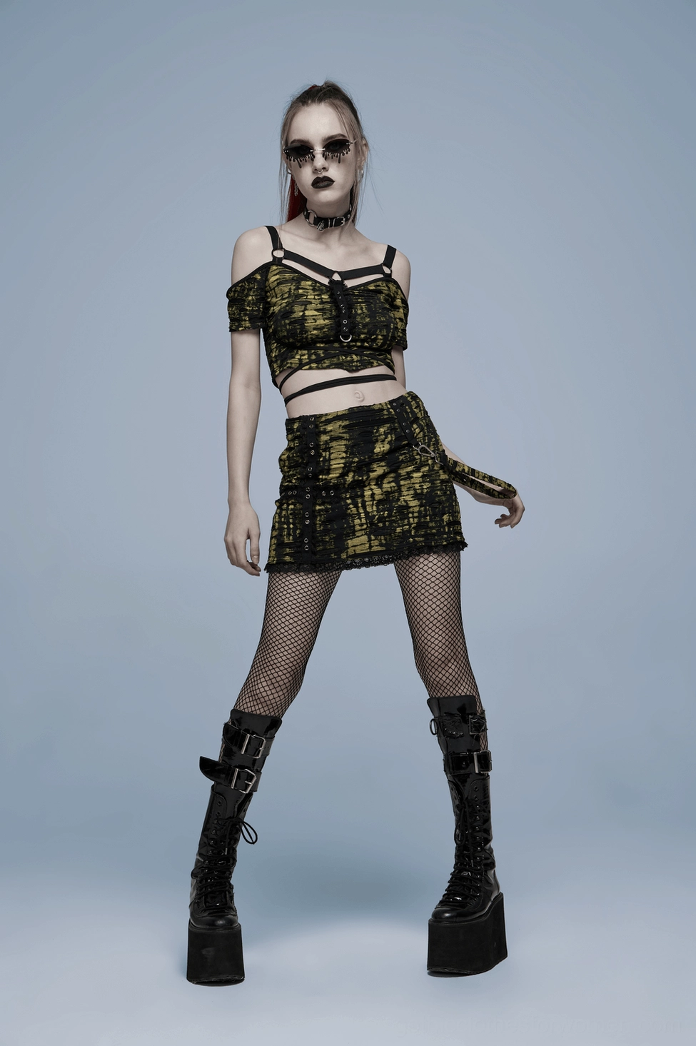 Product detail view of gothic distressed mini skirt with cross motif tie-dye knit and reinforced eyelet hardware