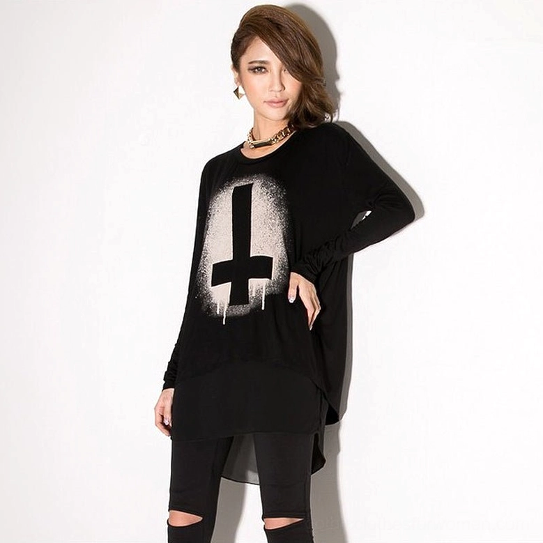 Cross print gothic chiffon batwing tunic top on model with choker and ripped black pants, front three-quarter view, goth aesthetic