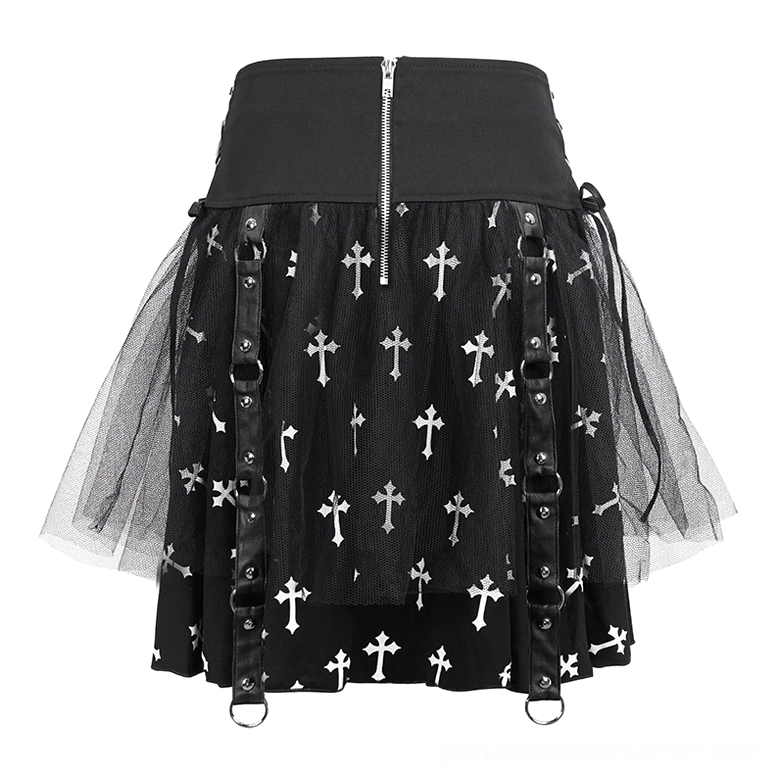 Flat lay product shot of black gothic cross print skirt showing front zipper waist, cross prints throughout fabric, and leather strap hardware details