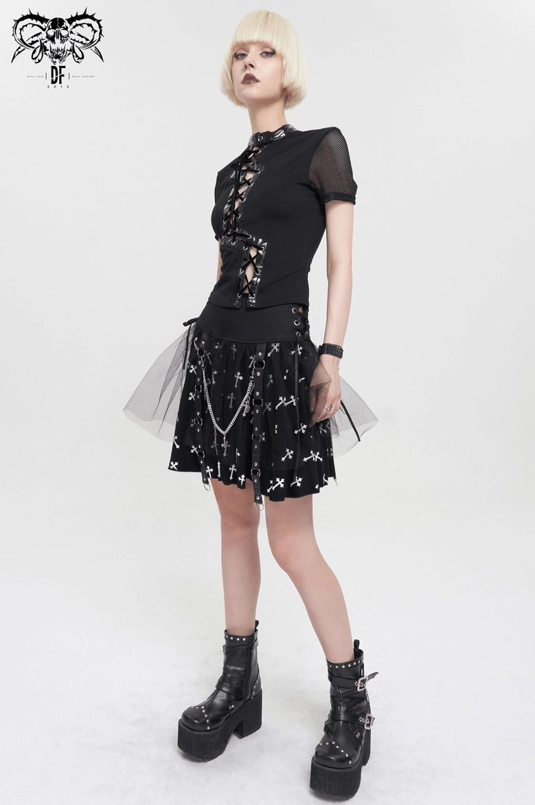 Black gothic cross print knitted skirt detail shot emphasizing white cross pattern repeat and delicate knit fabric texture