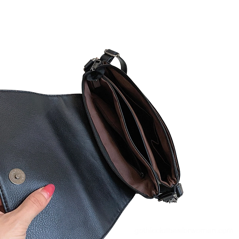 Interior compartment of gothic crossbody bag - polyester lining with zipper pocket and magnetic snap closure
